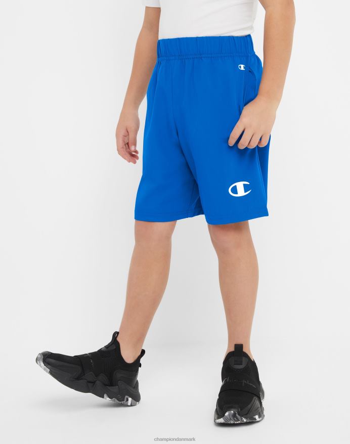 Champion store børns vævede drengeshorts fugttransporterende reflekterende c-logo 7 V6J661878 bor i blåt
