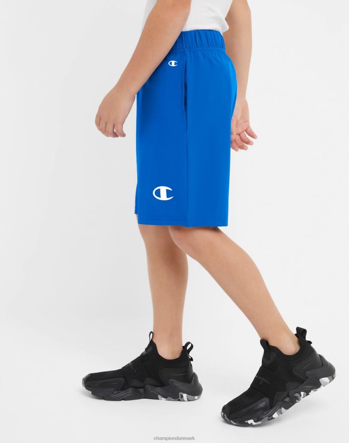 Champion store børns vævede drengeshorts fugttransporterende reflekterende c-logo 7 V6J661878 bor i blåt