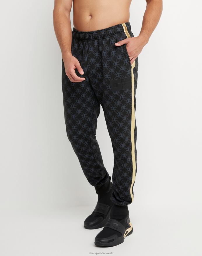 Champion klassiske fleece joggers all-over print med jock tag i imiteret læder 31 V6J66255 c logo links aop sort