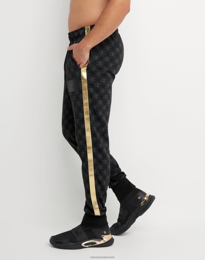 Champion klassiske fleece joggers all-over print med jock tag i imiteret læder 31 V6J66255 c logo links aop sort