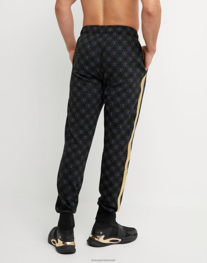Champion klassiske fleece joggers all-over print med jock tag i imiteret læder 31 V6J66255 c logo links aop sort
