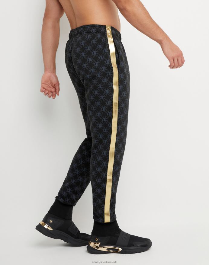 Champion klassiske fleece joggers all-over print med jock tag i imiteret læder 31 V6J66255 c logo links aop sort