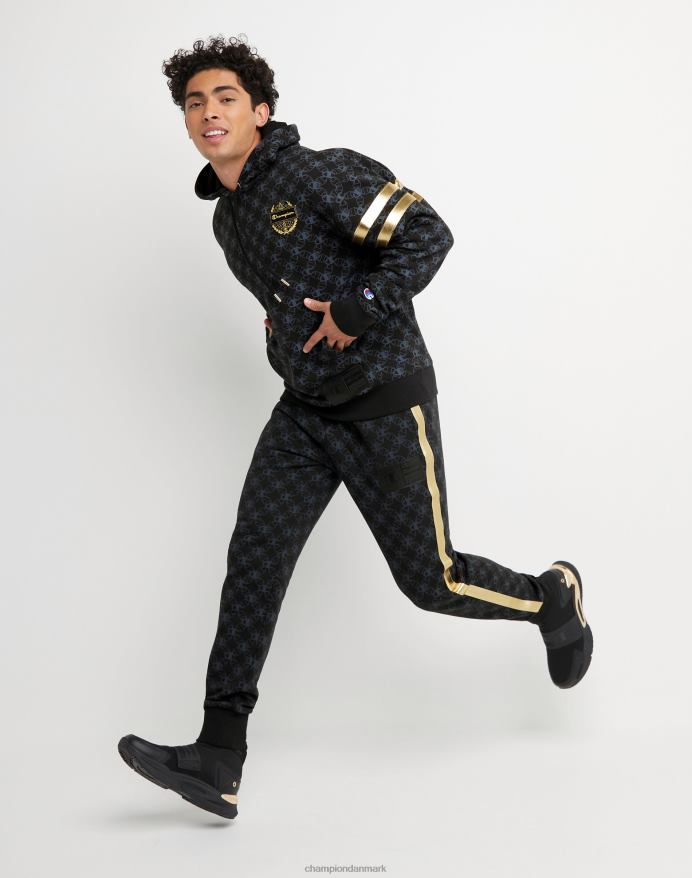 Champion klassiske fleece joggers all-over print med jock tag i imiteret læder 31 V6J66255 c logo links aop sort