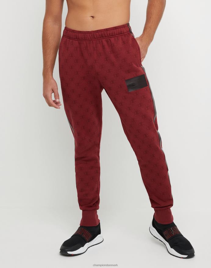 Champion klassiske fleece joggers all-over print med jock tag i imiteret læder 31 V6J66256 c logo links aop kardinal