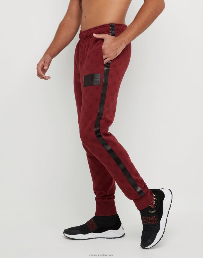 Champion klassiske fleece joggers all-over print med jock tag i imiteret læder 31 V6J66256 c logo links aop kardinal