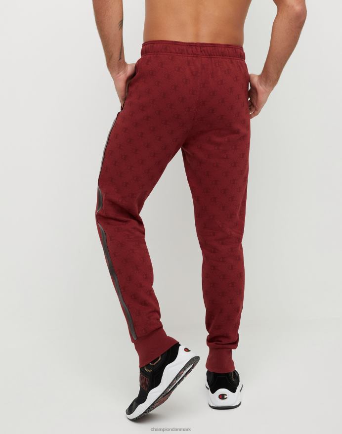 Champion klassiske fleece joggers all-over print med jock tag i imiteret læder 31 V6J66256 c logo links aop kardinal