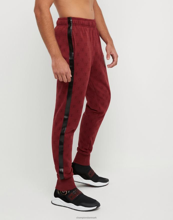 Champion klassiske fleece joggers all-over print med jock tag i imiteret læder 31 V6J66256 c logo links aop kardinal