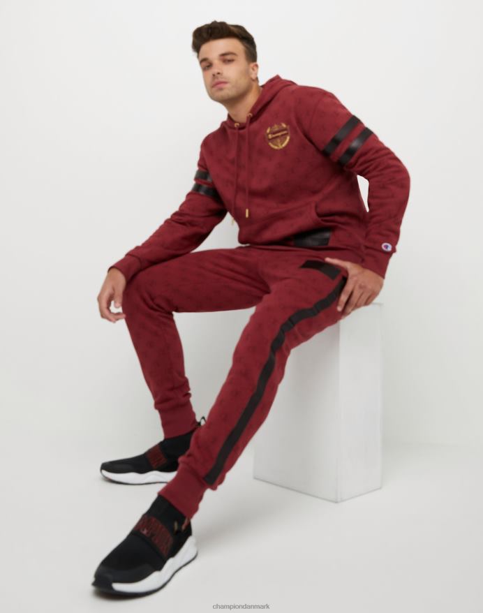 Champion klassiske fleece joggers all-over print med jock tag i imiteret læder 31 V6J66256 c logo links aop kardinal