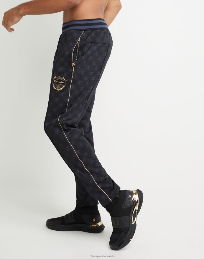 champion allover print joggebukser guld lurex logo medaljon V6J66283 c logo aop sort